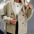 Person wearing a beige coat with a blurred background