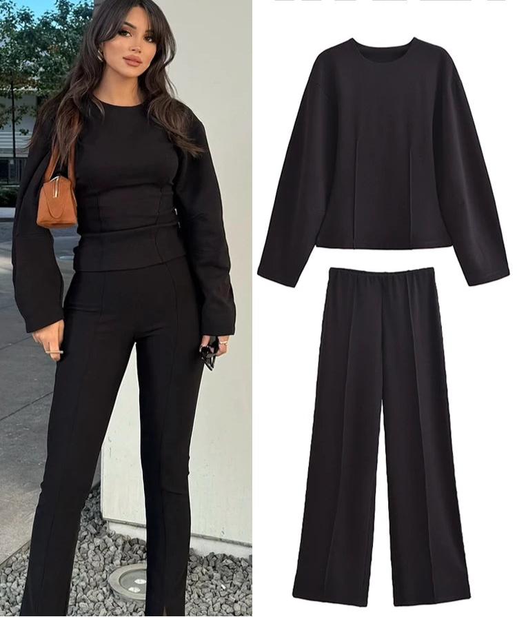 Woman wearing a black outfit with 'Trafza' branding on clothing images.